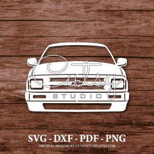 May include: White silhouette of a Chevrolet S-10 pickup truck front end with the text "Cutesy Studio" below the grill.