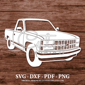 May include: White silhouette of a pickup truck with a grille and headlights. The truck is on a woodgrain background. SVG - DXF - PDF - PNG. Original designs by CutsyStudio.Etsy.com