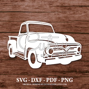 May include: White silhouette of a vintage pickup truck on a brown wood background. The truck has a long hood and a large grille. The image includes the text "SVG - DXF - PDF - PNG" and "ORIGINAL DESIGNS BY CUTSYSTUDIO.ETSY.COM".