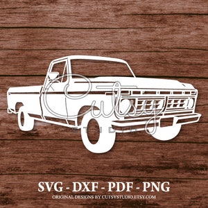 May include: A white silhouette of a vintage pickup truck on a brown wood grain backdrop. The image features the text "Cutsy Studio" and file type options: SVG, DXF, PDF, and PNG. The truck design is a vector graphic.