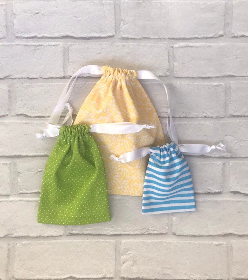 reusable fabric gift bag. Medium drawstring green gift bag