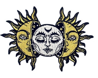 May include: A black and gold embroidered patch featuring a sun and moon with faces. The sun and moon are intertwined and have a celestial design.