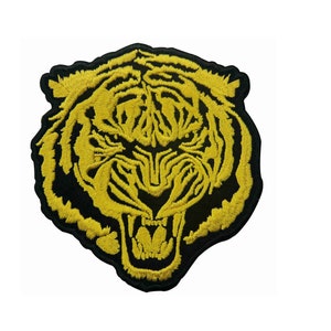 May include: A yellow embroidered tiger head patch on a black background.