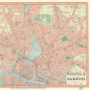 May include: A vintage map of Hamburg, Germany, featuring a detailed street layout in shades of pink, green, and blue. The map includes the Alster lake and the harbor, with text in German. Published by Flemmings Verlag.