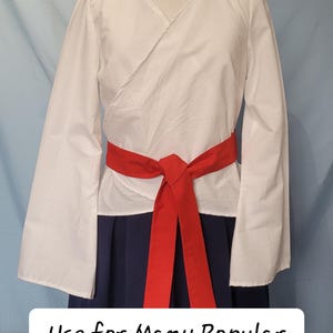 May include: White wrap top with long sleeves and a red sash tied at the waist. The text "Use for Many Popular Cosplays!" is below the image.