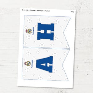 May include: Two printable pennant flags with a white background and a blue letter, "H" and "A", in the centre. The flags are decorated with a white football pattern and a Real Madrid logo. The text "Realmadrid" is written vertically on each flag.