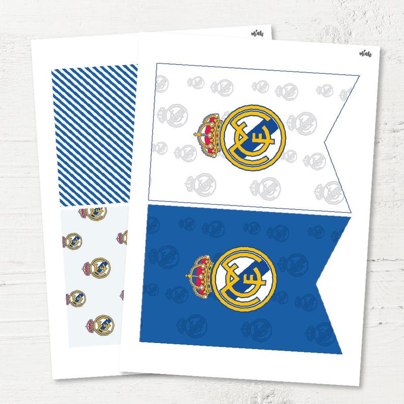 May include: Printable Real Madrid football team banner with a white background and a blue background. The banner features the Real Madrid logo with a crown and the letters "RM" in the centre. The banner is perfect for a Real Madrid themed party or event.