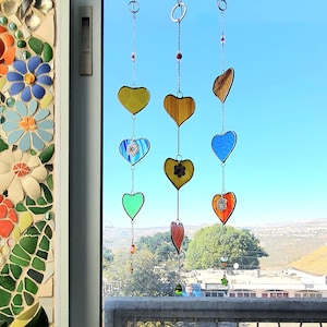 Stained glass heart suncatchers on a chain. Suncatcher hanger for window decoration and perfect gift for him and for her