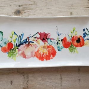 May include: A rustic wooden sign with the text "Welcome to our home" in white lettering. The sign features a distressed finish and a simple, inviting design, perfect for entryway decor.