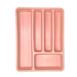 May include: A rectangular, light pink plastic cutlery tray featuring five distinct compartments for organizing kitchen utensils. The tray includes one long vertical slot on the left and four smaller, varied sections on the right side.