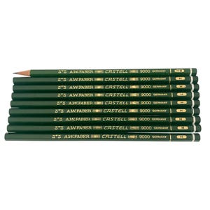 May include: A stack of ten dark green pencils with the text "A.W. Faber Castell 9000 Germany" printed on each. One pencil is sharpened, showing the graphite tip. The pencils are arranged horizontally, with the tips pointing to the left.