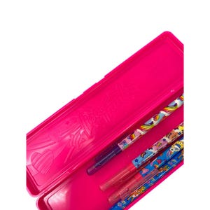 May include: A bright pink pencil case with a decorative design, open to reveal several colorful pencils. The pencils feature various patterns, including rainbows and stars. The case is rectangular and has a hinged lid.