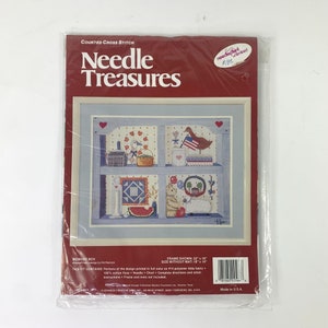May include: A counted cross stitch kit titled "Memory Box" by Needle Treasures. The kit includes a printed design of a blue shelf with a variety of Americana-themed items, including a watermelon, a birdhouse, and a lamb. The kit is framed and measures 56 cm by 46 cm.