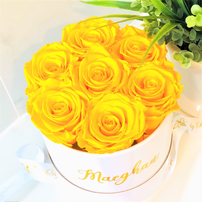 Preserved roses in a round personalized gift box. Yellow roses in a white round box. Orly Bee Designs