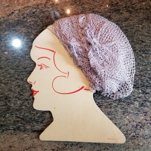 Vintage hair net display with 10 hairnets grey