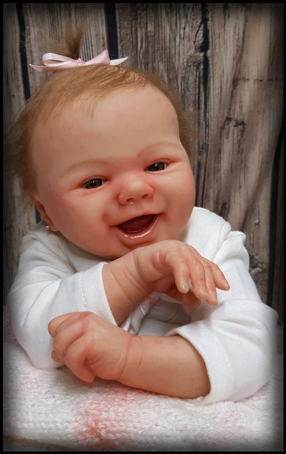 smiling reborn doll