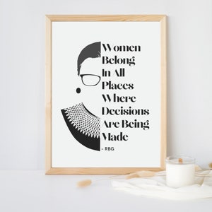May include: A black and white print of Ruth Bader Ginsburg with the quote "Women Belong In All Places Where Decisions Are Being Made - RBG".