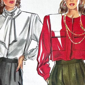 May include: Two women's blouses, one white with a large bow tie and the other red with a white collar and two pockets. Both blouses have long sleeves.