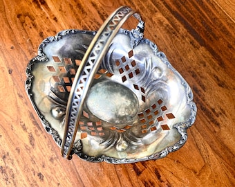 Forbes Silver Co. silver plate bride's basket, pierced sides, swivel handle, scrolled & scalloped edges; w/o handle 9.25" x 7 3/8" x 3".