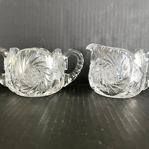 Antique American Brilliant Period cut glass creamer and sugar, twirling stars, crosshatching, thumbprint edges, excellent condition.
