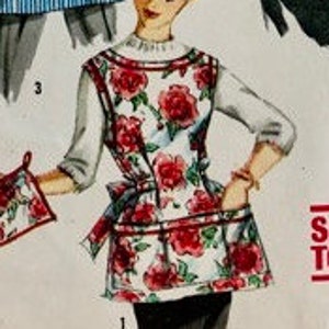 May include: Vintage apron with a floral rose pattern in red and white, featuring a matching pot holder. The apron has a white top and a tie-waist design. The image is a vintage illustration.