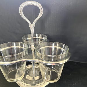 Chrome and clear glass 3-bowl Irvinware condiment server that spins, excellent condition, made in the USA; 10.25" tall x 9" wide.