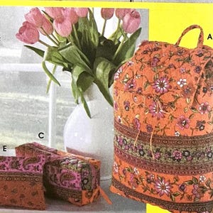 May include: A quilted fabric collection featuring a backpack labeled A, a rectangular pouch labeled E, and a tall bottle carrier labeled F. Each item displays a vibrant orange and pink floral pattern with paisley accents and dark trim.