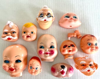 Vintage doll and character faces, vinyl or plastic, bright colors, different sizes, selling separately.