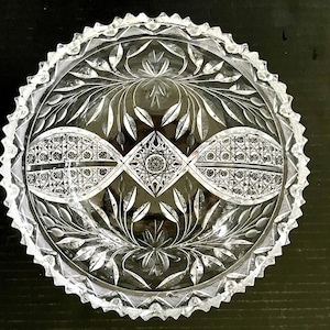 Heavy cut lead crystal glass bowl with frosted & clear florals, cross-hatching details, stars-in-faceted squares cuts; 8&quot; diameter x 3.75&quot;.
