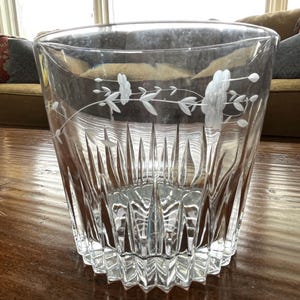 Vintage Princess House crystal ice bucket with etched florals and sawtooth base, heavy and in excellent condition; 5.5" t x 6 1/8" at rim.