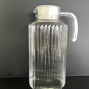 Luminarc refrigerator glass pitcher with ribbed sides and white plastic lid, excellent condition.