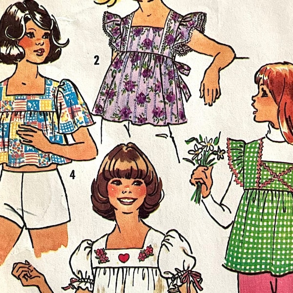 UNCUT 1975 Simplicity 6912 girl's and teen's pullover tops with sleeve options, shoulder ruffle, tie back, yoke; size 12-14, busts 30"-32".