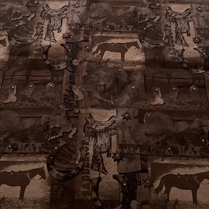 45&quot; wide x 2 yards long all cotton fabric AKQ &quot;Rustic Charm&quot; in a western equestrian print in dark browns and taupes, not preshunk.