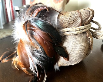 Native American hand-woven and stitched basket, fur, feathers, beads.