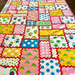 69" wide x 87" long vintage polyester double knit pieced quilt with poly-cotton sheet backing, tied with yarn, good condition; fun colors!! image 5