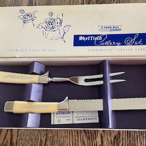 Mid-century Regent Sheffield cutler set in original box, appears unused, stainless steel blades, ivory handles, the Miracle Worker.