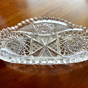 American Brilliant Period diminutive cut glass celery dish at 7 5/8&quot; long x 3 5/8&quot; wide, perfect to hold mints or olives, some chipping.