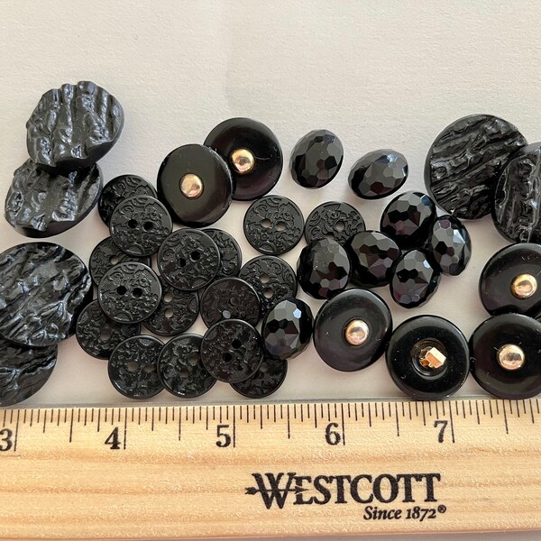 Lot for 37 vintage black buttons, some faceted, some with gold ball inserts, some with shank backs, some look like bark, all are very pretty