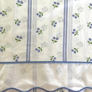 Vintage Fieldcrest king-sized flat or fitted sheet in lavender and green florals and strips, 50/50 cotton poly, not for deep mattresses.