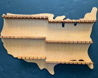 Vintage wooden spoon display rack in the shape of the United States, great condition, 61 slots for spoons; 23.5" wide x 16" tall x 1.5" d.