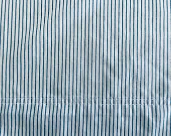 Twin-sized flat bed sheet, 100% cotton by Better Homes & Gardens, narrow blue strips on white, excellent condition.