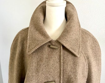 Vintage women's wool or wool blend fully lined swing coat, barrel buttoned front, tabbed cuffs, raglan sleeves; size XL or XXL, 48" long.
