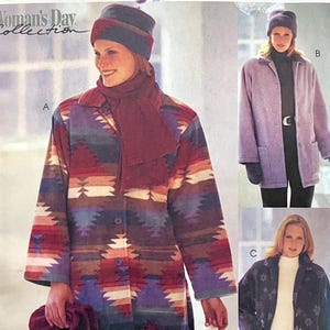 May include: A multi-colored coat with a Southwestern pattern, a matching scarf, and a hat. The coat has a button-up front and long sleeves. The image also shows a lavender coat and a navy coat with a floral pattern. The text "Woman's Day Collection" is visible.