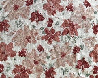 May include: A floral pattern featuring large, stylized flowers in shades of dusty rose and burgundy, interspersed with small green leaves, against a white background. The design has a textured, watercolor-like appearance, creating a soft, artistic aesthetic.