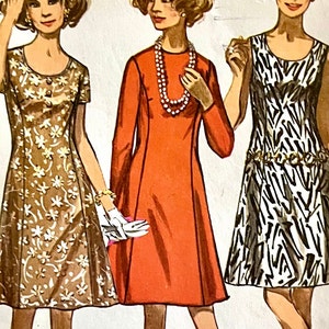 May include: Three women wearing different dresses. The woman on the left is wearing a brown dress with white floral print. The woman in the middle is wearing a red dress with a pearl necklace. The woman on the right is wearing a black and white zebra print dress with a gold belt.