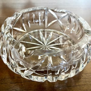 Heavy cut lead crystal ashtray for cigars or cigarettes, clear, deep cuts, some chips on inside rim; 6.5&quot; in diameter x 2.25&quot; tall.