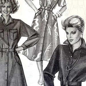 Puede incluir: Una ilustración en blanco y negro de tres mujeres que llevan diferentes estilos de vestidos. Los vestidos son todos abotonados y de manga larga. Los vestidos están todos ceñidos a la cintura. El texto "View A" aparece dos veces en la imagen.