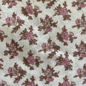 42&quot; wide x 10 yards 4&quot; long country cotton floral print in pink and green on cream background, excellent condition, selling by the yard.