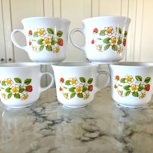 Vintage Corelle cups featuring the pattern &quot;Strawberry Sundae&quot;, all in excellent condition; no chips, cracks, crazing, scratches or fading.