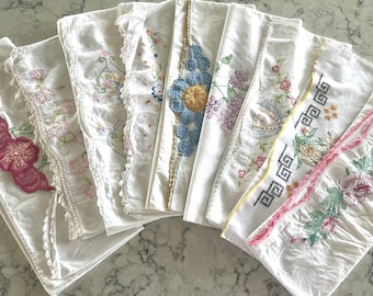 Vintage embellished cotton pillowcases, sold individually, all with embroidery, some with crocheted edge, all really pretty. Details below.